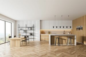 contemporary kitchen with light wood cabinets white upper cabinets herringbone hardwood flooring and large waterfall island